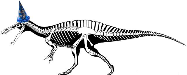 Theropod skeletal reconstruction in lateral view wearing a "Happy New Year" party hat